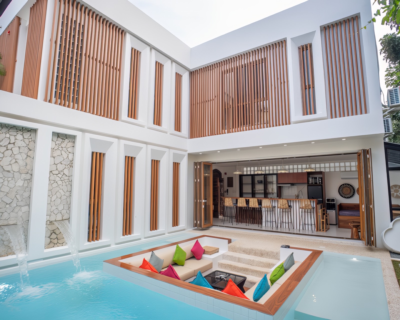 Private pool and sunken lounge with the villa's open kitchen behind