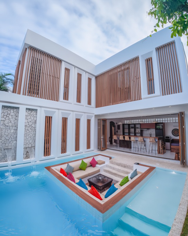Two-storey timber-and-stone villa above the private pool